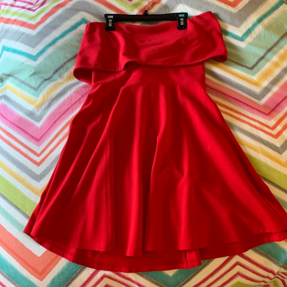 New condition, off the shoulder red dress with tie in the back.